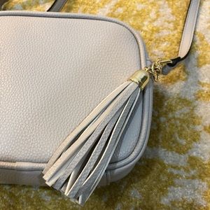 Light gray shoulder/cross body tassel purse